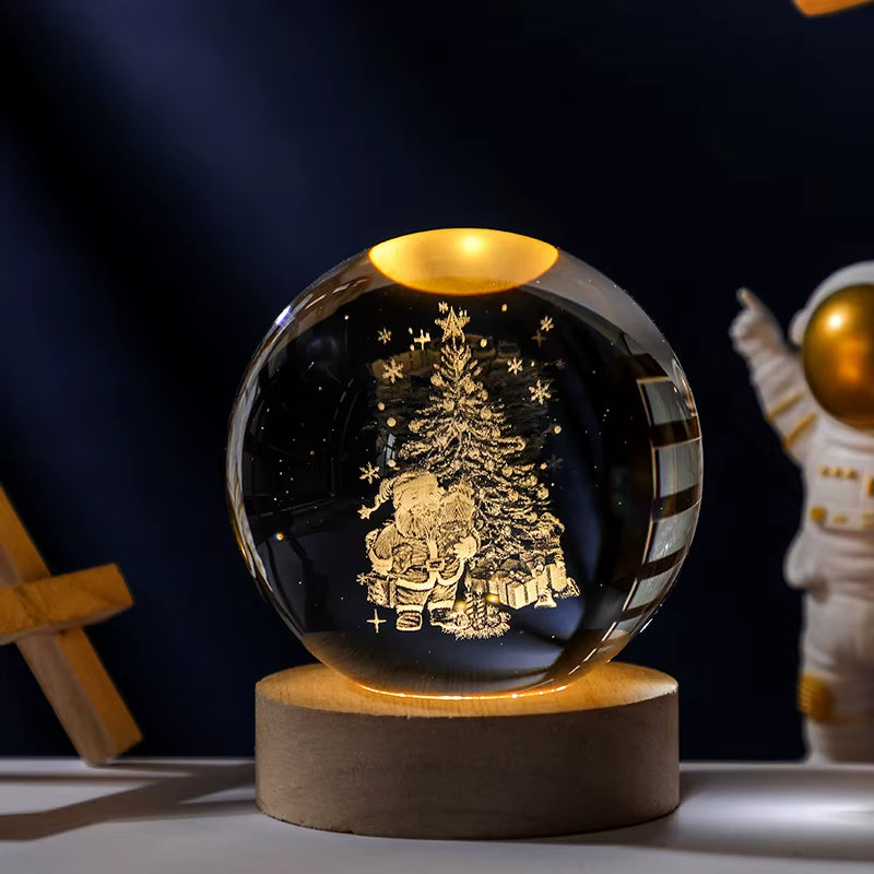Crystal ball with engraved design on a wooden base against a dark background