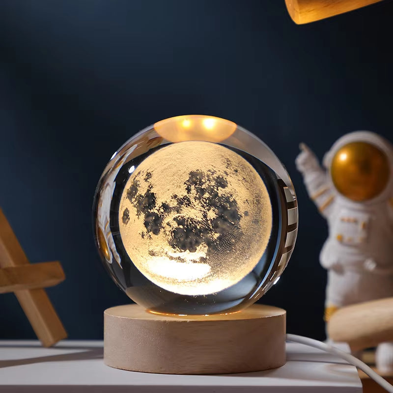 Moon lamp on a wooden base with an astronaut figurine in the background