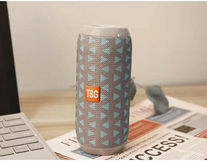 Waterproof Portable Bluetooth Speaker with Subwoofer, AUX, and FM Radio Functionality.